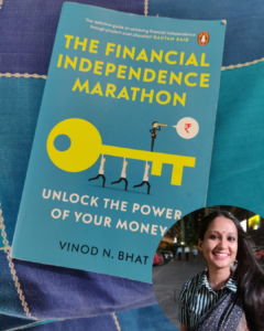 The photo shows a book blue coloured and a picture on the bottom of a woman smiling.